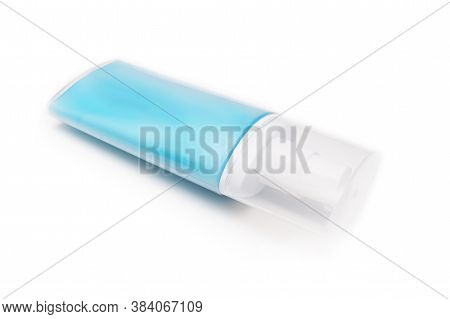 A Blue Plastic Conteiner, Bottle Of Moisturising Cream, Lotion With Dosator And Cap Isolated On Whit
