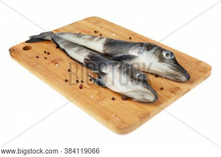Fresh Raw Mackerel Icefish Ice Fish On Wooden Cutting Board Isolated On White Background