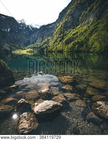 Obersee Lake Autumn Landscape. Stone In Crystal Water In Berchtesgaden National Park