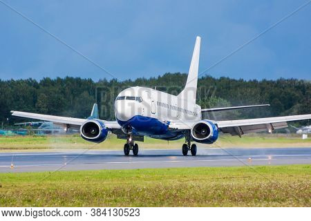 Airplane Landing On Runway. Touchdown With Tire Smoke