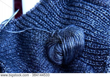 Needlework. Texture Knitted Fabric. Beautiful Knitted Blue Fabric With Metallic Fibers And Tangle As