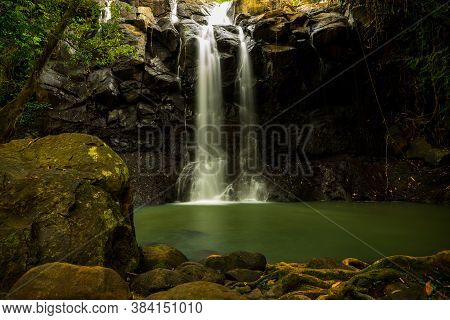 Tropical Landscape. Beautiful Hidden Waterfall In Rainforest. Adventure And Travel Concept. Nature B