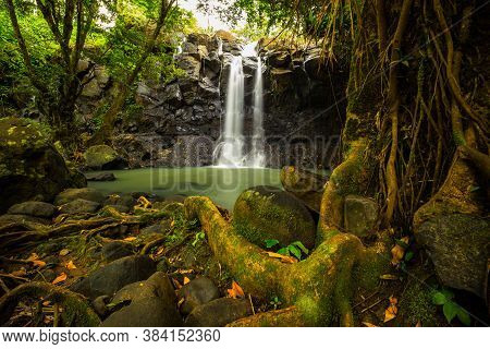 Tropical Landscape. Beautiful Hidden Waterfall In Rainforest. Adventure And Travel Concept. Nature B