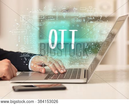 hand working on new modern computer with OTT abbreviation, modern technology concept