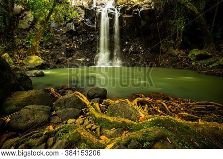 Tropical Landscape. Beautiful Hidden Waterfall In Rainforest. Adventure And Travel Concept. Nature B