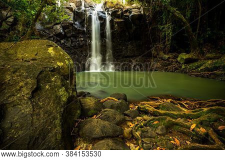 Tropical Landscape. Beautiful Hidden Waterfall In Rainforest. Adventure And Travel Concept. Nature B