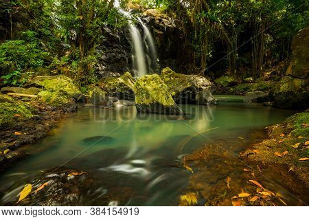 Tropical Landscape. Beautiful Hidden Waterfall In Rainforest. Adventure And Travel Concept. Nature B