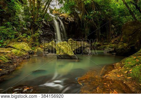 Tropical Landscape. Beautiful Hidden Waterfall In Rainforest. Adventure And Travel Concept. Nature B