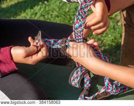 The Girls From The Equestrian Club Train To Put Together Horse Halters.