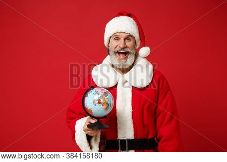 Excited Elderly Gray-haired Mustache Bearded Santa Man In Christmas Hat Posing Isolated On Red Backg