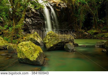 Tropical Landscape. Beautiful Hidden Waterfall In Rainforest. Adventure And Travel Concept. Nature B