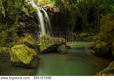 Tropical Landscape. Beautiful Hidden Waterfall In Rainforest. Adventure And Travel Concept. Nature B