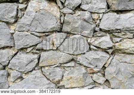 Rock Wall Background. Closeup. Copspace. Natural Gray Texture