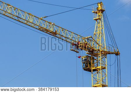 Construction Site Background. Hoisting Cranes And New Multi-storey Buildings. I.ndustrial Background