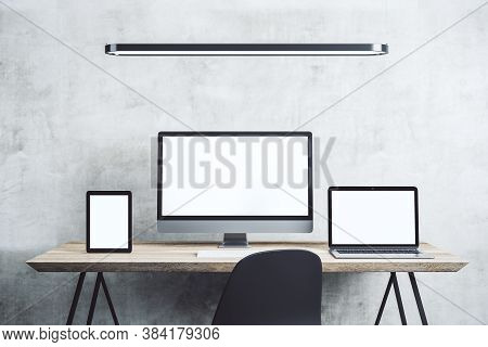 Digital Tablet, Computer Monitor And Laptop With Blank Screen On Table. Technology And Communication