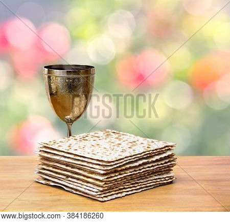 Matzo And Wine In Bowl For Passover Celebration On The Wooden Table  On Defocused Of Natural Backgro