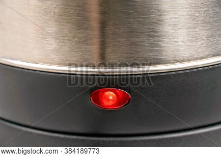 Lower Half Of A Grey Electric Kettle With A Red Light On, Macrophotograph