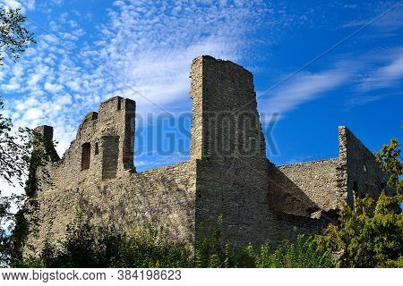 Picture Ruins Of A Medieval Castle With A Background Of Summer Sky With Fine Clouds, Hukvaldy, Czech