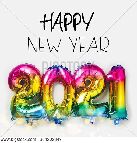 Rainbow colored Foil balloons in the form of numbers 2021. New year celebration