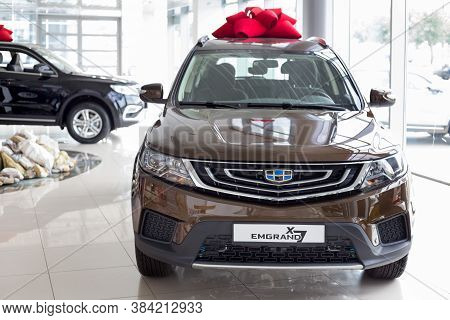 Russia, Izhevsk - August 14, 2020: New Modern Emgrand X7 In The Geely Showroom. Front View.