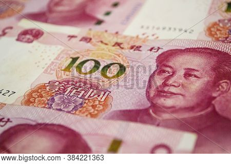 100 Chinese Renmin Bi Banknotes Background. China, Beijing.