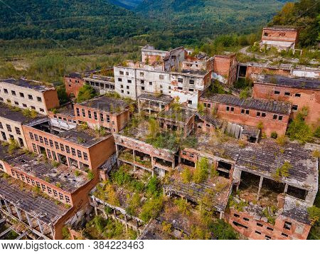 View From Above. Ruined And Abandoned Buildings Of A Tin Mining Factory In The Village Of Kavalerovo