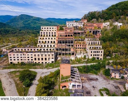 View From Above. Ruined And Abandoned Buildings Of A Tin Mining Factory In The Village Of Kavalerovo