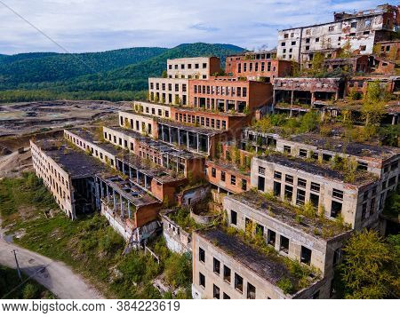 View From Above. Ruined And Abandoned Buildings Of A Tin Mining Factory In The Village Of Kavalerovo