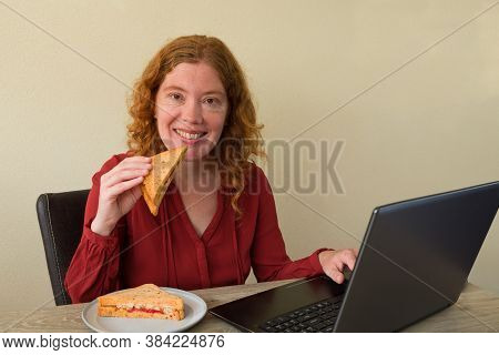 Causasian Woman Enjoying Breakfast Or Lunch While Working Or Learning At Home