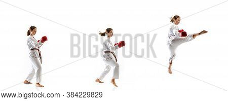Flying. Junior In Kimono Practicing Taekwondo Combat, Martial Arts. Young Female Fighter With Red Gl