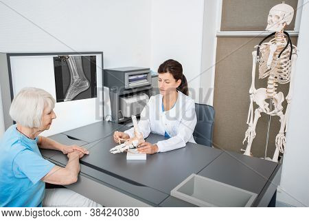 Rheumatologist And Senior Patient, Consultation. Ankle And Leg Injury. Diagnostics And Treatment Of 