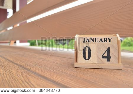 January 4, Number Cube With Wooden Balcony Background.