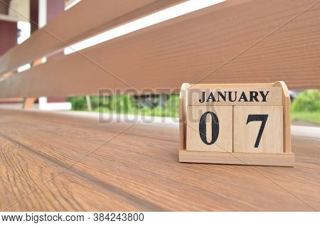 January 7, Number Cube With Wooden Balcony Background.