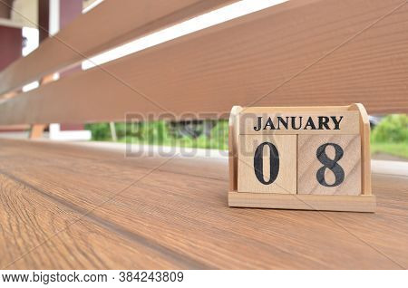 January 8, Number Cube With Wooden Balcony Background.