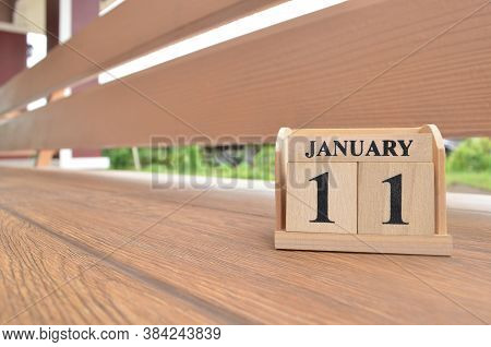 January 11, Number Cube With Wooden Balcony Background.