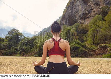 Yoga Classes In Nature. The Concept Of Playing Sports Alone. Social Exclusion. A Woman Does Yoga On 