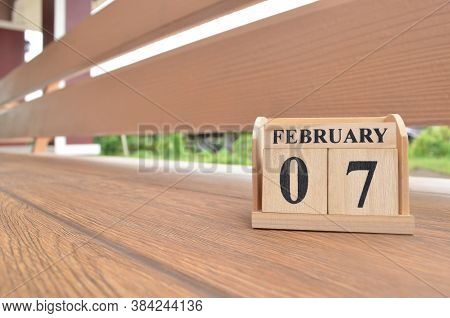 February 7, Number Cube With Wooden Balcony Background.