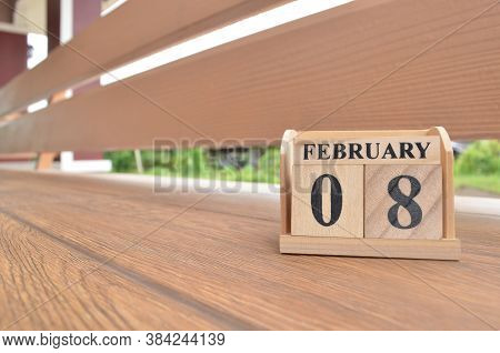 February 8, Number Cube With Wooden Balcony Background.
