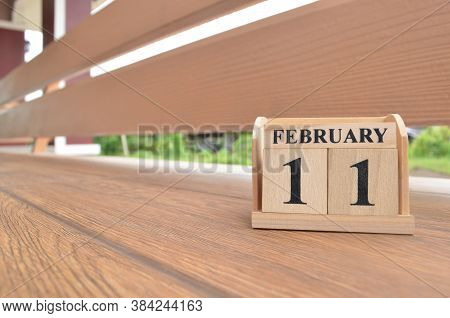 February 11, Number Cube With Wooden Balcony Background.
