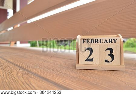 February 23, Number Cube With Wooden Balcony Background.