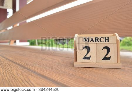 March 22, Number Cube With Wooden Balcony Background.