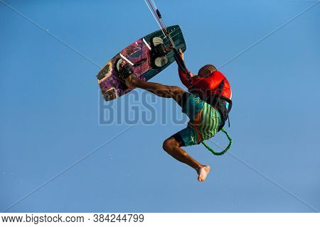 Kitesurfing on the waves of the sea in Mui Ne beach, Phan Thiet, Binh Thuan, Vietnam. Kitesurfing, Kiteboarding action photos. Kitesurf In Action 