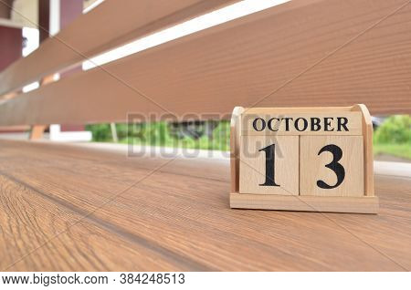 October 13, Number Cube With Wooden Balcony Background.