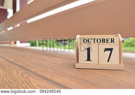 October 17, Number Cube With Wooden Balcony Background.