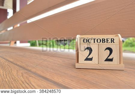 October 22, Number Cube With Wooden Balcony Background.