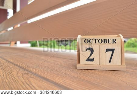 October 27, Number Cube With Wooden Balcony Background.