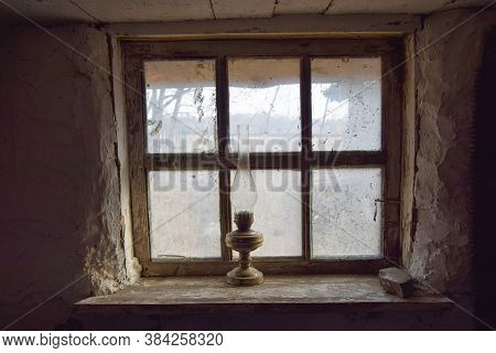 The Window Of An Old Clay House With A Kerosene Lamp On The Sill. Ertil Village. Voronezh Region. Ru