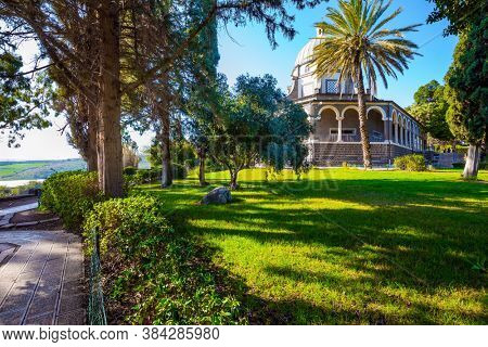 Blooming huge park around the monastery. The Catholic Church of the Beatitudes of the Italian female Franciscan monastery on Mount Bliss. The Sea of Galilee. Israel.  concept of religious pilgrimage 