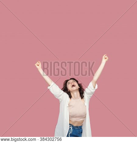 Portrait Of Happy Satisfied Beautiful Brunette Young Woman With Curly Hairstyle In Casual Style Stan