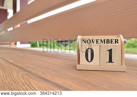 November 1, Number Cube With Wooden Balcony Background.